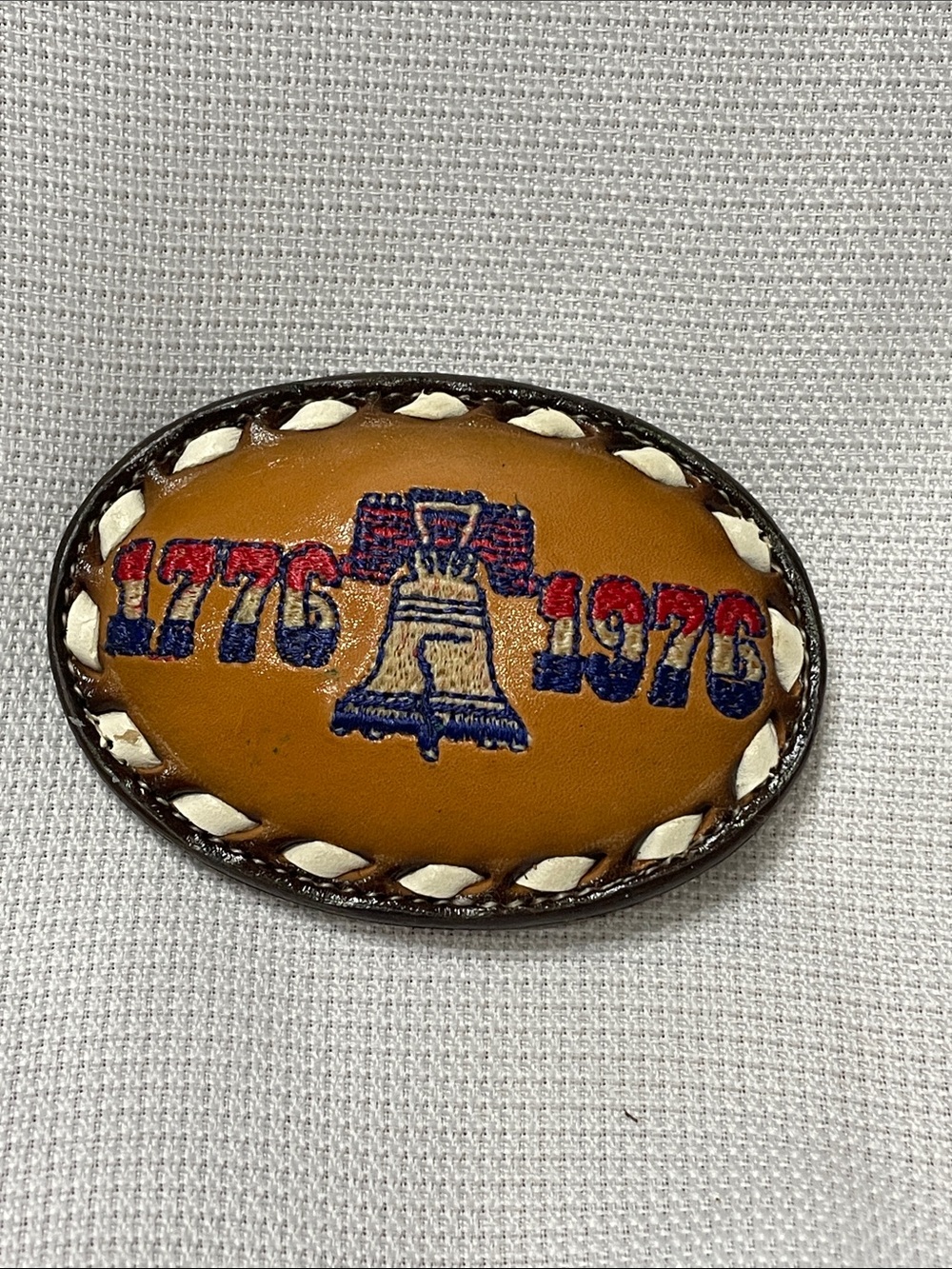 Vintage Tony Lama  1776-1976 Leather Belt Buckle pre-owned. Some wear. Brown.